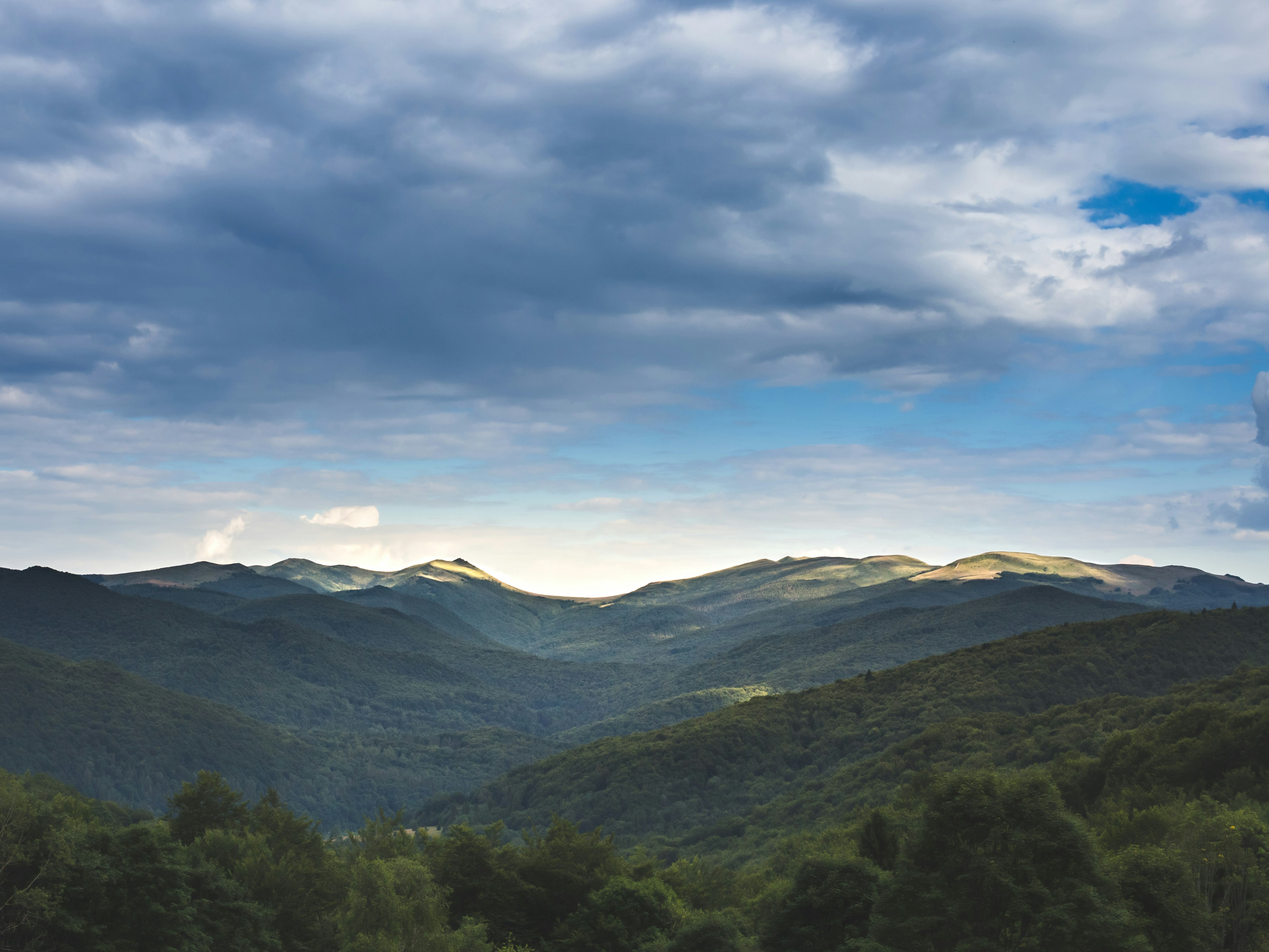 grass mountains during day